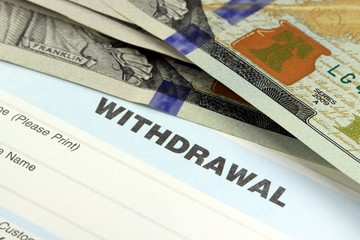 Withdrawal slip from bank checking or savings account - Finance and accounting concept