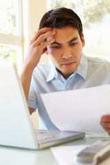 Filipino man working at home