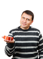 the man holds a red gift on the palm