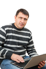 Fototapeta premium The puzzled man with laptop isolated on white