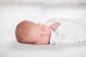 Newborn baby peacefully sleeping