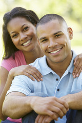 Fototapeta premium Portrait Of Romantic Young African American Couple In Park