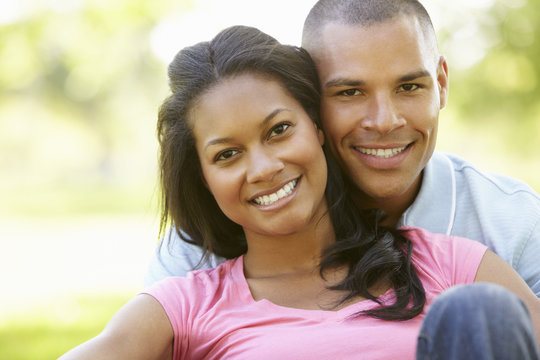 Portrait Of Romantic Young African American Couple In Park