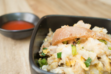 Fried Thai Noodle with seafood with dip on wooden table