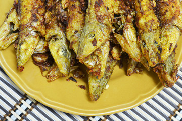 fried fish with turmeric