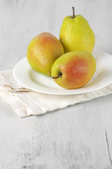Pears on white wood