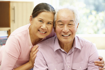 Senior Asian couple at home
