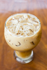 Iced coffee with milk is on the table.