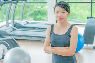 Asian young women with exercise equipment at the gym