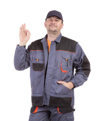 Working man smiling with ok sign.