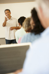 Obraz premium Teacher and mature students in class