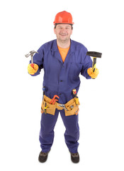 Worker in hard hat holding hammers.
