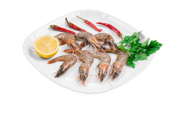Fresh shrimps on plate with pepper.