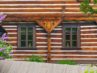 Fototapeta na wymiar Two windows of old timbered house