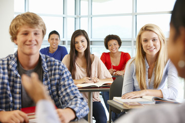 Multi racial teenage pupils in class