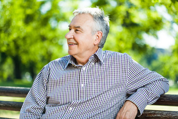 Portrait of happy senior man in park