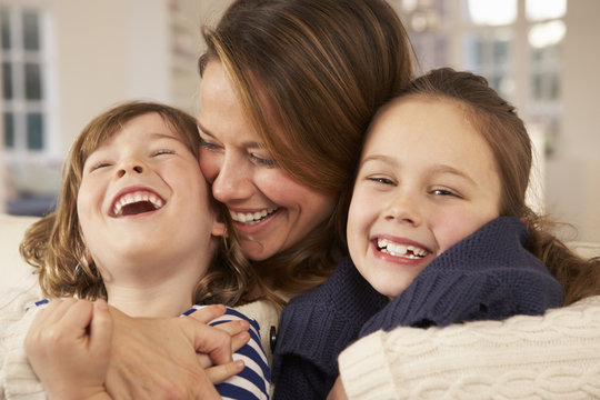 Portrait Mother And Children At Home