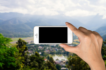 Phone in hand and blurred city