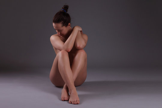 Fototapeta Young beautiful nude woman with towel practicing yoga