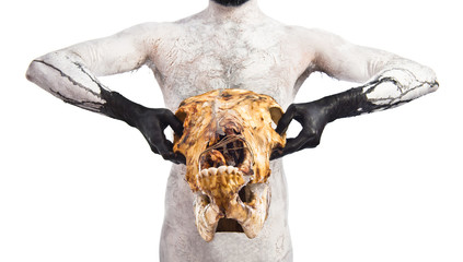Primitive man holding veal skull