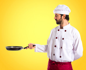 Chef holding frying pan