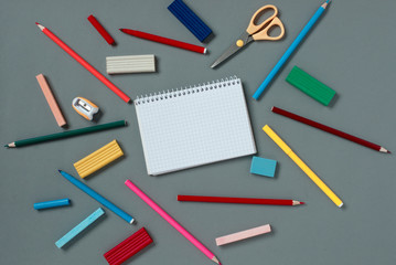 Blank notebook with stationery supplies