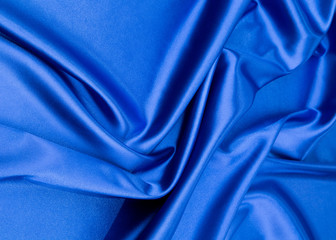 Blue silk cloth texture close up.