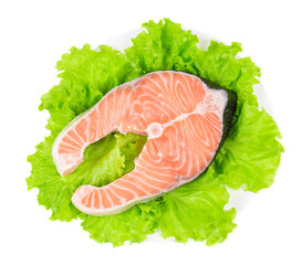 Fresh salmon steak on lettuce.
