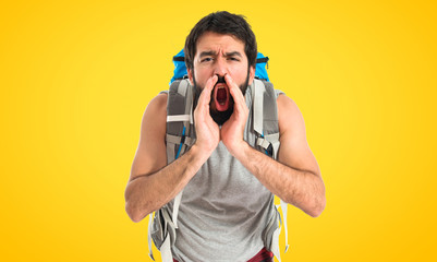 Backpacker shouting over isolated white background