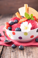 bowl with ice cream and biscuit