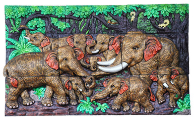 Low relief cement Thai style handcraft of elephant.