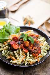 low angle view of a serving of Italian spaghetti on wood table