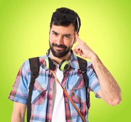 Tourist thinking over white background