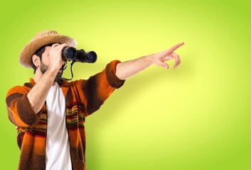 Tourist with binoculars over white background