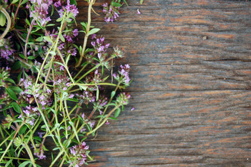background of fresh thyme on wooden table