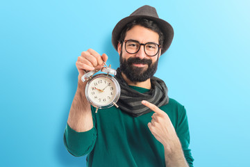 Man holding vintage clock