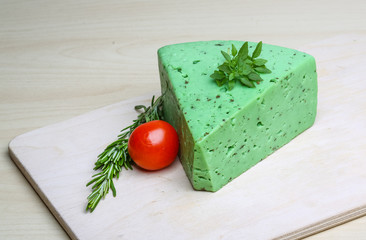 Green pesto cheese and basil leaves