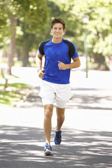 Man Running Through Park