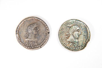 Vintage silver coins with portraits of kings on a white backgrou