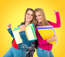 Lucky students over isolated white background