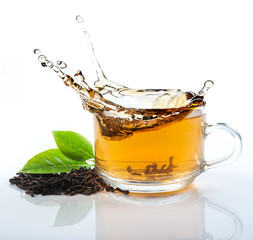glass cup of tea withsplash out