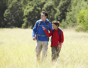 Father And Son On Hike In Beautiful Countryside