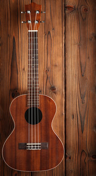 ukulele on wooden background