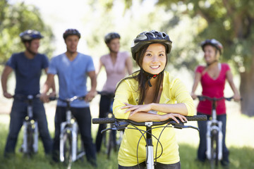 Fototapeta premium Group Of Young Friends On Cycle Ride In Countryside