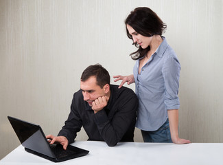 Couple looking at laptop screen