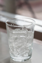 Glass of pure water with ice