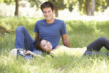 Naklejka na ściany i meble Young Couple Relaxing In Countryside