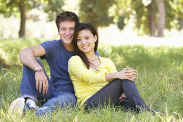 Young Couple Relaxing In Countryside