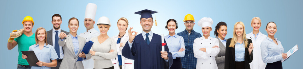 happy bachelor with diploma over professionals