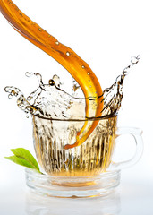glass cup of tea withsplash out